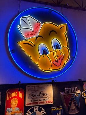 Grab your grocery list! This large and very collectible 1950s #PigglyWiggly single-sided porcelain with animated #neon sign is sure to turn some heads when it's hanging in your game room or #garage. This vibrant sign is selling at the 2025 #Scottsdale #Automoilia Auction with No Reserve, Jan. 18-26 at WestWorld.