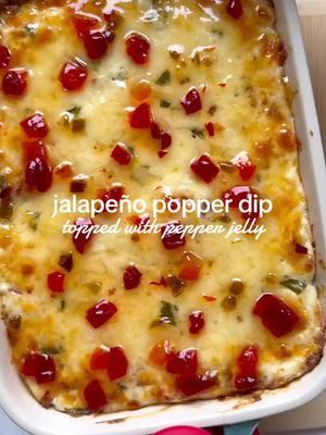 This Jalapeño Popper Dip went viral last year so I want to share it again to remind you to make this for the Super Bowl! I topped my dip with some hot and sweet pepper jelly for an absoluteee flavor explosion!  Use the link in my bio to be taken to my blog directly @spinachandbacon  The creamy savory cheese and garlic mixed with the slightly spicy jalapeños and then the sweet and spicy jelly on top just balances it all out! I served these with tortilla chips, but they would taste great with some wonton chips as well! https://spinachandbacon.com/2024/01/18/jalapeno-popper-dip/ #SuperBowl #gameday #appetizer #jalapenopoppers #fyp