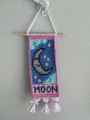 I made this pattern for the first time in 2021 maybe? I love it so much besides the fact that any wall hanging with borders is HARD. #fyp #tiedwithlovebyae #SmallBusiness #tiedwithlovebyaewallhanging #twlbae2025 #wallhanging #moon #tarrotcard