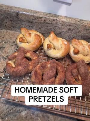 HOMEMADE SOFT PRETZELS  Recipe:   -1 1/2cups of warm water -2 1/4 instant yeast (1 packet) -1 tsp salt -1 tbsp sugar -4 cups flour -8 cups water -4 tbsp baking soda -1 large yolk -1 tbsp water 1. In a large bowl mix water, yeast, salt, & sugar. Allow to sit 1-2 minutes. Add flour and mix in a mixer with a hook or by hand with a spoon. Mix for 4-5 minutes or until dough is soft & smooth 2. Shape dough into a ball. Cover with  dish towel and let rest for 20 minutes. After resting, cut in 8 pieces. Roll each into a long rope, make a teardrop shape, twist the ends, and fold over to make a pretzel.  3. Preheat oven to 450F. Make baking soda bath by boiling 8 cups of water in a large pot. Once boiling, add in your baking soda one tbsp at a time. (It will bubble up so be careful) add each pretzel for 30 seconds and remove with a slotted spoon 4. Place pretzels on greased or lined cookie sheet. Make egg wash mixture with egg yolk and water, then brush over pretzels. If you would like salt, add now. Bake for 12-14 minutes or until golden brown 5. Brush with butter and if making cinnamon sugar ones dip in cinnamon sugar after putting on butter   ENJOY  #food #foodtiktok #snacks #pretzels #softpretzel 