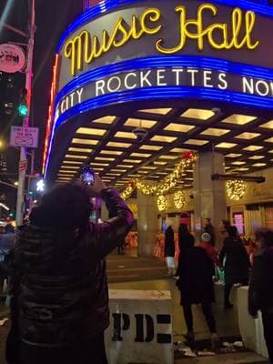 A Quick Look at NYC’s Legendary Radio City Music Hall The holiday season in New York City wouldn’t be complete without passing by the legendary Radio City Music Hall. Known for its dazzling lights and rich history, this iconic landmark draws attention as a centerpiece of Manhattan’s festive atmosphere. I didn’t go inside or take a tour, but just standing outside this architectural masterpiece was enough to feel the magic. Built in 1932, Radio City Music Hall is an Art Deco masterpiece and a cornerstone of NYC’s entertainment history. Known as the "Showplace of the Nation," it has hosted legendary performers, iconic events, and, of course, the world-famous Rockettes. Its legacy and energy are unmatched, especially during the holidays when it shines brighter than ever. Join me as we admire the beauty and significance of this incredible NYC landmark, a true must-see during the holiday season. . . #Vlog #newyorkcity #dailyvlog #travelplanning  #RadioCityMusicHall #NYC #NYCHolidays #IconicLandmark #ManhattanVibes #FestiveSeason #NYCChristmas #HistoricVenue #Rockettes #HolidayMagic 