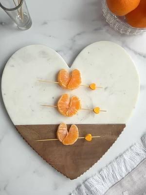 🧡🍊Clementine Hearts 🧡🍊 By placing two pieces of clementines together on a skewer you can create an illusion of a heart. Add these to a charcuterie board or use as a fun snack for the kids!  . . ✨Follow along for more Charcuterie Boards, Midwest Accents, Tutorials, Recipes & more! . #charcuterieboard #Recipe #charcuterie #theboardloon #cheeseboard #cheeseplatter  #charcuterieworkshop #cheese #appetizer #fyp