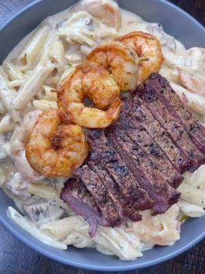 Cajun Creamy Steak & Shrimp Alfredo  Ingredients  - 2 New York strips steak  - Seasonings (Old bay , Slap ya mama, Cayenne pepper, Garlic powder, onion powder, chipotle chili pepper, creole) - Garlic herb butter - Colossal Shrimp  - Penne noodles  - Heavy cream  - Boursin cheese  - Colby jack (Optional) Steak  - Seasonings steak both sides (Old bay , Slap ya mama, Cayenne pepper, Garlic powder, onion powder, chipotle chili pepper, creole) start off with 1 teaspoon of each if you are not comfortable eyeballing  - To your cast iron skillet at 1 tablespoon olive oil just to ensure steak will not stick - Allow skillet to get hot  - Place steak in skillet  - Sear each side 3-4 mins  - After you get a nice sear on both sides rotate additional 3-5mins & bast steak with butter (for better results you can bast steak with garlic & herb butter, Garlic cloves, Thyme & rosemary)  Also keep in mind each temperature on a steak has a different cook time.  - once cooked to desired temperature  - Allow steak to rest  - Once steak has rest cut into cubes  Cajun Shrimp  - Peel , Clean , Devine your shrimp  - Season (Old bay , Slap ya mama, Cayenne pepper, Creole)  - To a pan add 2 tables garlic & herb butter  - Add seasoned shrimp  - Cook shrimp 5-8 mins or until shrimp color changes & curl up Cajun Alfredo Sauce  - to the same skillet you cooked shrimp in add 2 cups of heavy cream  - 1 whole block Boursin cheese  - 1/2 cup of Colby jack (optional) - 1/2 teaspoon Cayenne pepper  - 1/2 teaspoon Chipotle chili pepper  - 1/2 teaspoon slap ya mama  - 1/2 teaspoon old bay  - Mix well until it becomes a sauce consistency  - Add noodles  - Add steak  - Add shrimp  - Add 1/3 cup of Colby jack cheese  - Allow to simmer for additional 5 mins  Enjoy  #fyp #trending #kaikyianna #cooknwkai #cooknwkaikyianna #cajunalfredo #pasta 