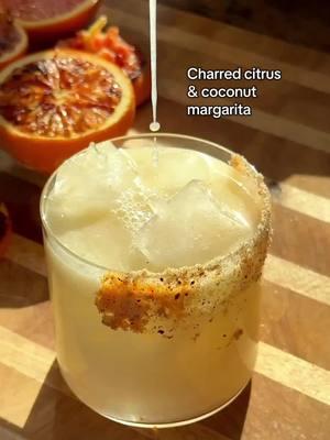 When the margaritas start to feel like this again >>>> First margarita of the year & this perfectly incorporates our winter citrus! Charring the citrus is always optional 🍊 Here’s how to make it at home: Char your citrus, citrus side down for about 5 minutes.  To a cocktail shaker add: 1 oz Cara Cara orange juice 1/2 oz lime juice 1.2 oz hot honey 1.5 oz coconut milk 1.5 oz tequila blanco, or tequila alternative spirit, or filtered water  Add ice and shake! Double strain into a rocks glass filled with ice and rimmed with your favorite salt. Xoxo, cheers! #cocktailrecipes #drinkrecipes #summerdrinks #margarita #margaritarecipe #citrusseason