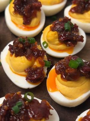 Replying to @Easy E 211 the best deviled eggs ever are bourbon bacon jam topped deviled eggs, okay? Because I said so. #baconjam #bourbonbaconjam #deviledeggs #appetizers #southernrecipes #southernfood #foodietiktok #viralrecipes  Recipe: -10 eggs -1/3 cup mayo  -1/2 tbsp Dijon mustard  -1/2 tsp dried mustard powder  -1 tsp dill pickle juice  -1/2 tsp worchestershire sauce  (Paprika , pepper, salt, onion & garlic powder not measured)  -chives for garnish (The recipe for the bourbon bacon jam is in my “Savory” playlist!) 1.) Boil eggs. Place in ice bath or run under cold water to stop the cooking process  2.) Remove yolks from whites then combine all ingredients (besides chives and whites) until smooth. Place in piping bag (can also use a spoon) 3.) Top with bourbon bacon jam then chives. Parsley can also be used as a garnish or the garnish can be skipped completely, as well. Enjoy!