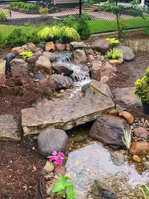 Taking a stroll by the front yard stream😍  #iowawaterscapes #justaddwateria #iowa #desmoines #waterfall #pond #outdoorliving #landscaping #waterscape #aquascape #fountain #koipond #waterfeature 