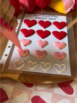 Let’s make some heart royal icing transfers!  ❤️ Start by printing your template and adding it to a binder sheet or placing a clear treat bag or parchment paper on top. Use a thicker royal icing to outline your hearts and then flood. Top with some optional Valentine’s Day sprinkles then let dry over night. Carefully pop the transfers off your sheet and use a little royal icing to add your transfers to your Valentine’s Day cookies and other sweet treats! #asmr #asmrsounds #royalicing #royalicingcookies #cookies #sugarcookies #cookiedecorating #decoratedcookies #cookievideo #tutorial #baking #ValentinesDay #cookiesoftiktok #cookietutorial 