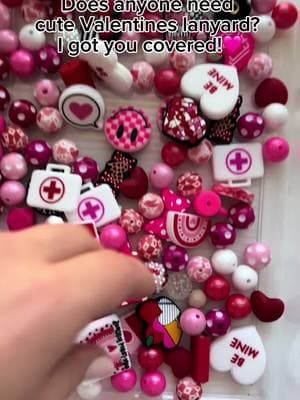 Does anyone need Valentines Day themed lanyards? Let me know ! #lanyard #lanyards #ValentinesDay #valentine #teachersoftiktok #teachertok #nursetok #nurselife #gifts #valentinesgift #lanyardtutorial #handmadegifts 