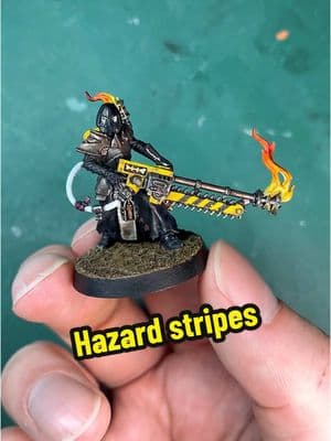 I decided to add some hazard stripes to Pious Vorne — here’s how I did it —— #warhammercommunity #warhammer #warhammerpainting #paintingwarhammer #warhammer40k #necromunda 