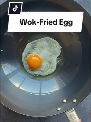 In just a few minutes, top your stir-fry with a wok-fried egg. Cook for 1 minute for a runny yolk and up to 2 minutes for a fully set yolk with crispier edges. You can find this carbon steel wok on our site for only $99. #zwilling1731 #zwilling #wokfriedegg #carbonsteel #carbonsteelwok #friedegg #woktips