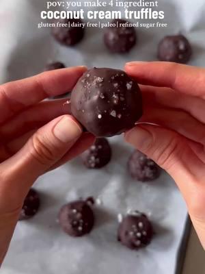 These 4 Ingredient Coconut Cream Truffles are gluten free, dairy free, paleo, and refined sugar free, and can even be made sugar free! They’re so easy to make and so good. Ingredients: •1/3 cup canned coconut cream •3/4 cup shredded, unsweetened coconut •1/3 cup dark or semi-sweet chocolate (I used dairy free and refined sugar free chocolate — use sugar free chocolate to keep the recipe sugar free) •1 tsp coconut oil Instructions: 1. Mix together the coconut cream and shredded coconut in a bowl then scoop the mixture with a tablespoon or cookie dough scoop and roll into balls. 2. Place the balls on a tray lined with parchment paper and place in the freezer for at least 1-2 hours to harden. 3. Once the balls are hardened, melt the chocolate and coconut oil in the microwave or using the double boiler method, stirring frequently until melted. 4. Once the chocolate is melted, remove the coconut balls from the freezer and dip each one in the melted chocolate. Place the chocolate coated balls back on the lined tray and sprinkle with flaky sea salt (optional).  5. Place the truffles in the fridge until the chocolate shell hardens, then dig in and enjoy! Store leftovers in the fridge. Notes: •For a sweeter truffle filling, use sweetened coconut flakes or add a little bit of a natural sweetener to the truffle filling (e.g. honey, maple syrup, coconut sugar) •If the filling is too dry, add more coconut cream. If it’s too wet, add more coconut flakes. #coconutcream #chocolatecoconut #truffles #vegantruffles #refinedsugarfree #healthydessert #nobakedessert #sugarfreedessert #paleodessert #glutenfreedessert #almondjoy #moundsbar 