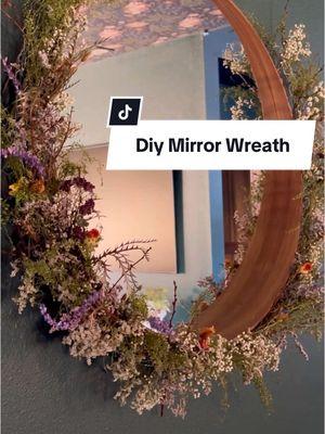 I love being able to reuse home decor I already have, and give it a completely new life 💫 This mid century modern mirror wasn't quite right anymore for my romantasy living room makeover, so a DIY was in store. I have wanted some sort of dried floral installation in here to lend to that fairytale feel, and thought why not turn it into a wreath! 💐  Some chicken wire, cheap filler florals from Trader Joe's, and foraged dried flowers later, I'm in love with this beautiful piece of art that better fits my new aesthetic! All without having to buy a new piece, which is a win in my book 📕  #darkandmoody #homedecor #cottagecore #darkacademia #homemakover #roommakeover #homeproject #nerdcorehomeseries #darkandlovely #livingroom #livingroommakeover #acotar diy project, wreath making, furniture flip