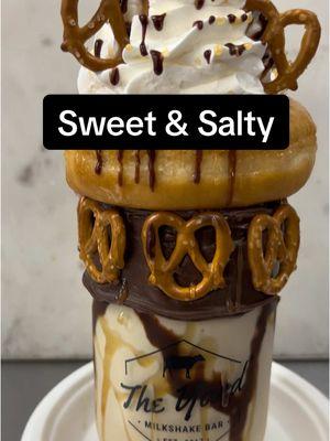 Sweet & Salty: Sea Salt Caramel ice cream with chocolate and caramel drizzle in a chocolate iced jar with mini pretzel twists around the rim. Topped with a glazed doughnut, whipped cream, 3 mini pretzel twists, caramel and chocolate drizzle. #theyardmilkshakebar 