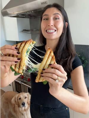 Breakfast panini (no panini press needed!)✨ ▪️1 tsp Olive Oil▪️1 Cup Baby Spinach, plus more for serving▪️Salt & Pepper▪️2 Eggs▪️1 Tbsp Butter, softened▪️2 Slices Sandwich Bread (I used sourdough)▪️1 Slice Cheese (I used Swiss cheese)▪️ 1️⃣ In a large nonstick pan over medium heat, sauté the spinach in olive oil until tender but not completely wilted (~1 min).  2️⃣ Beat the eggs with salt and pepper and them to the pan. Spread into one layer and cook undisturbed until the eggs cook through in one flat sheet, like an open face omelet (~2 mins). Turn off the heat and fold the edges of the eggs in to create a rectangle the size of the bread, then transfer onto a plate.  3️⃣ Spread softened butter on two pieces of bread. Flip the bread over so the butter is facing out, and add the eggs and cheese. Place the second piece of bread on top of the sandwich, buttered side facing out.  4️⃣ Preheat a grill pan or medium skillet over medium heat. Add the sandwich and place a piece of parchment paper on top of the sandwich. Place a heavy skillet on top to gently press down. Cook until golden brown (~3 mins), remove the skillet and parchment paper, flip the sandwich, and press down with the parchment and skillet on top. Cook on the other side until golden brown (1-2 mins).  5️⃣ Carefully open up the sandwich and add some more fresh spinach if desired. Slice in half and enjoy! ⏲10 minute total prep + cook time Recipe makes 1 panini . #maxiskitchen #recipesoftikok #EasyRecipes #easymeal #recipeideas #breakfastideas 