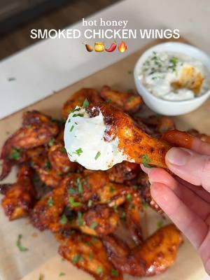 HOT HONEY SMOKED CHICKEN WINGS 🍗🍯🌶️🔥 The Super Bowl is in just a few weeks, and every year I make homemade chicken wings! This year I’m stepping up my game by making smoked chicken wings tossed in homemade hot honey glaze… these are seriously the BEST wings I have ever had! They are sweet, spicy, sticky, and smoky - everyone will love them! 😍 I smoked the wings on the brand new @Traeger Grills Woodridge grill! It adds the most delicious smoky flavor to meat, fish & veggies, and is so easy to use and clean! 🙌 Smoked wings:  - 2 lbs chicken wings  - 1 tbsp avocado oil  - 1 tbsp paprika - 1 tbsp garlic powder - 1 tbsp onion powder - 2 tsp salt  - 1/2 tsp black pepper  - 1/4 tsp cayenne pepper Hot honey glaze: - 1/4 cup honey - 2 tbsp hot sauce (I love Franks) - 2 tbsp butter - 1/2 tsp red pepper flakes How to:  - Preheat smoker to 250F. - Pat wings dry with paper towels. Add to a big bowl and toss in avocado oil.  - Mix together all of the spices and sprinkle over the wings, tossing so each wing is evenly coated in the seasoning. - Place wings in the smoker and smoke for 1 hour.  - While the wings are smoking, add all of the ingredients for the hot honey glaze to a saucepan and whisk until it starts to bubble, then turn down the heat and whisk for 1-2 minutes until well combined.  - Remove the wings from the smoker and turn it up to 500F. Sear the wings for 1-2 minutes on each side until they have a light char.  - Add the wings to a large bowl and drizzle over the hot honey glaze. Toss to evenly coat. - Garnish with diced parsley and serve with blue cheese or ranch. Enjoy! 🫶 #traegergrills #gamedayrecipe #SuperBowl #chickenwings #smokedwings #EasyRecipe #superbowlrecipe 