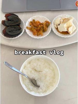 Breakfast vibes, but make it cozy 🥣✨.  Starting the day with congee and three homemade sides:  🥚 Preserved duck egg for that creamy umami kick. Do yall remember when this was on Fear Factor? 😂😂 🌶️ Spicy pickled veggies for a tangy crunch  🥢 Tofu in sesame & soy sauce for nutty, savory perfection  Simple, comforting, and SO good! 🌞  #BreakfastTok #CongeeLove #AsianFoodie #ComfortEats #FoodieLife #HomemadeRecipes #CozyVibes #FoodTikTok #EasyMeals #BreakfastGoals #breakfastideas 