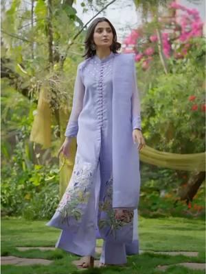 Aangan | An elegant front slit shirt tailored on a dreamy lavender canvas with sheer sleeves and elaborate floral embroidery along the borders. Delicate crystal detailing on the front and sleeves gives the outfit a chic look. It is paired with a matching pair of culottes and a sheer dupatta Shop now: www.shramya.com #shramya #aangan #gulbahaar #shramyacollection #festivewear #custommade #maketoorder #salwarsuits #salwaarkameez #follow #explore #instashop #reels #instagood #instagram #instafashion #traditionalwear #like 