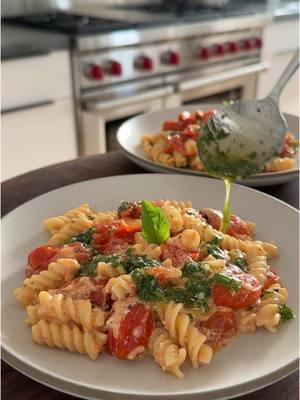 Tomato ricotta pasta with basil parmesan oil✨ Inspired by the roasted tomato feta pasta that went viral a couple years ago 🤍 Pasta:▪️4 Cups Cherry Tomatoes (20 oz.)▪️1/4 Cup Olive Oil▪️1 tsp Kosher Salt▪️1/4 tsp Pepper▪️1 Cup Ricotta (8 oz.)▪️2 Garlic Cloves, finely chopped▪️8 oz. Rotini, or pasta of choice (1/2 a package)▪️ Basil Parm Oil:▪️1/2 Cup Fresh Basil Leaves (.6 oz), finely chopped▪️1/4 Cup Olive Oil▪️2 Tbsp Grated Parmesan▪️1 Small Pinch Kosher Salt▪️ 🌱Vegan Modification: Leave out the ricotta and sub in nutritional yeast for parmesan 1️⃣ Preheat the oven to 400F. 2️⃣ To a 9x13” (or similar) baking dish, add the tomatoes, olive oil, salt, and pepper. Toss to coat the tomatoes evenly, then add the ricotta in large dollops on top of the tomatoes.  3️⃣ Bake uncovered for about 35 mins until the tomatoes are blistered and tender. 4️⃣ Meanwhile, bring a medium pot of generously salted water to a boil, and make the basil parmesan oil. To a small bowl, add the chopped basil, olive oil, parmesan, and salt. Mix.  5️⃣ 10 mins before the tomatoes are done, add the rotini to the boiling water and cook according to package directions until al dente (or to your liking). Drain and set aside.  6️⃣ Once the tomatoes are done, immediately add the garlic and cooked pasta to the dish. Stir until all ingredients are well combined, and the sauce coats the noodles.  7️⃣ Transfer onto plates and top with a generous drizzle of basil parmesan oil. Enjoy!  ⏲10 minute prep time + 35 minute cook time Recipe serves 2-4 people (depending on your appetite!) For all recipes delivered to your inbox weekly (with printable PDFs) + access to the searchable recipe archive, subscribe to my newsletter via the link in my bio 😘 . #maxiskitchen #recipesoftikok #EasyRecipes #recipeideas #easydinnerideas 