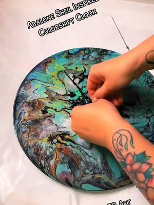 Abalone Inspired colorshift Acrylic Pour on Vinyl Record made into a clock #amytbart #art #artistsoftiktok #arttok #acrylicpour #colorshift #abaloneshell #vinylrecords #craftersoftiktok #colorshiftpainting 