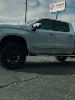 Nothing a lift kit, wheels and big tires can’t fix. This Chevy High Country is a beauty. #wheelparadise #liftedtrucks #chevytrucks #highcountry #xfoffroad #toyo #bigtires #wheelshop #fyp 