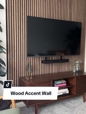 These Walnut Wood Slats look absolutely stunning in @emandbear ‘s living room! 😍⚡️💙 #woodslat #wallpanel #wooddesign #woodwallart #woodwall #woodwalldecor #woodslatwall #acousticwoodpanels #woodpaneling #woodpanel 