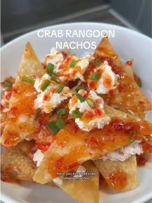 Crab Rangoon Nachos 🦀  After trying these at a restaurant, I was hooked and had to recreate them at home. They’re just that good! Ingredients you’ll need: 8oz Imitation Crab 8oz Cream Cheese Wonton Wraps 1/4 cup Mayo (I love using Kewpie Mayo for more flavor) 1 tablespoon Reduced Sodium Soy Sauce (add more if needed) Seasoning: Salt, pepper, garlic powder, onion powder A pinch of sugar Fry your wonton chips and set aside. Mix up the crab, cream cheese, mayo, and seasonings to create the filling. Build your nachos, drizzle with sweet chili sauce, sprinkle green onions on top, and dig in! #EasyRecipe #crabrangoon #nachos 