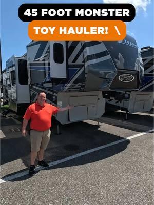 45 foot toy hauler fifth wheel with plenty of room for your side by side or ATVs! #toyhauler #atvlifestyle #sidebyside 