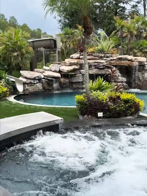 This backyard has a huge grotto, a waterslide, a big elevated spa with a swim-up bar, a sun shelf area, and a big swimming and jumping play area. This place is laid out for entertaining.
 
 #insanepools #lucaslagoons #pool #poolbuilders #backyard #luxurylife #waterslide 