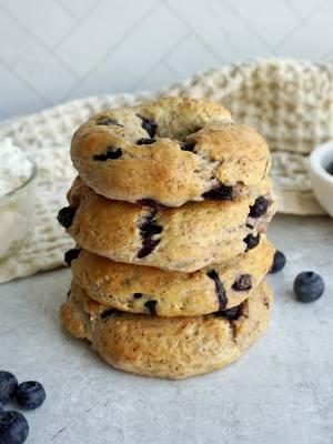 ROTEIN BLUEBERRY FLAX BAGELS! These are so easy to make and make the most delicious breakfast all week long. I made these last Wednesday and they were my favorite way to start each day. I would just pop them in the air fryer, top with cream cheese and enjoy with some air fryer turkey bacon. So yummm! These are the perfect way to sneak in a little extra protein in the mornings too- I hope you try!! SAVE THIS POST and SEND to someone you wanna try them with 🫐 Recipe: * 1 1/4 cup all purpose flour * 1/4 cup ground flax * 2 tsp baking powder * 1/2 tsp salt * 1 cup plain greek yogurt * 1/2 cup frozen blueberries, can also use fresh 1. To start, preheat the oven to 375F and prepare a baking sheet by lining it with parchment paper or a silicon baking mat. 2. In a large mixing bowl, combine flour, salt, baking powder, and ground flax. Whisk the ingredients until they are well combined. 3. Next, add in the greek yogurt and mix using a spatula, then use your hands to knead until you have a dough. Fold in the frozen blueberries and knead until they are well incorporated. 4. Flour your hands once more and flour a clean working surface. Bring the dough out of the bowl and place it on the flour surface. Begin to kneed to dough once more to ensure everything is really well combined. Dough will be sticky so don’t be afraid to sprinkle with a little flour to make it more workable. 5. Roll the dough into one large ball and using a knife, cut into four equal parts. 6. Roll each section into a log then connect the two ends to create a circle. 7. brush each bagel with an egg wash and bake for 25-27 minutes or until the tops of the bagels are golden brown. 8. Allow the bagels to cool down slightly before enjoying. #blueberrybagels #greekyogurtbagels #proteinbagel #breakfastmealprep