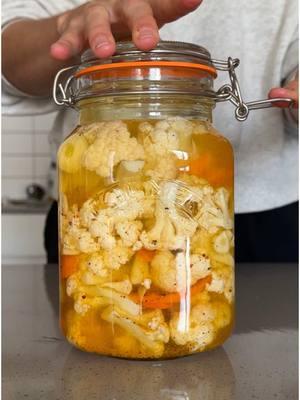 Fermentation ebook: link in bio! 🥰 Pickling vs Fermenting — why the confusion? 🥒🧅 Some foods, like dill pickles, include the word pickle but can actually be fermented. So what's the difference? The key difference is the source of acidity. In pickling, vegetables are soaked in a vinegar based brine which creates all the flavor. The tangy taste comes from the vinegar, not a biological process. Pickling is usually faster and ready within a few hours or days, however the end result is not probiotic. Fermenting, on the other hand, preserves food through the activity of beneficial microbes and the acidity and tangy taste is created by naturally produced lactic acid. Vegetables are submerged in a saltwater brine and left to ferment at room temperature for several days or weeks. No vinegar is used because it actually kills the beneficial bacteria needed for the fermentation process. The flavor profile is more complex, they're rich in probiotics, but the method also takes longer. 🫙 #fermentation #pickles #guthealth 