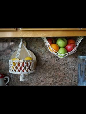 Macrame fruit baskets and hangers are available on my Etsy.  • Hang your fruit in style today!  • 🍊Macrame fruit baskets🍎Fruit hammocks🍌Banana hangers- grab yours today.  • #macrame #macrameartist #macramelove #macramedecor #macramedesign #fruitstorage #fruitbasket #fruithammock #handmadecraft #macramehanging #angscraftsncreations #onthisday 