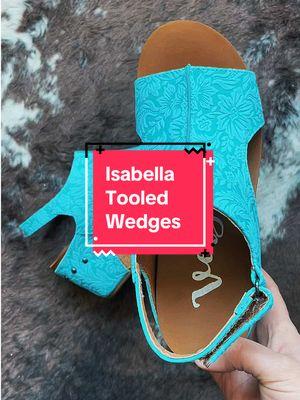 Be a trendsetter with the Isabella Tooled Wedges in Turquoise by Very G. These bold colored wedges combine style and comfort in one stylish package. The adjustable Velcro ankle strap ensures a secure fit, while the cork-like wedge adds a touch of natural beauty. The foam-cushioned foot bed provides unmatched comfort, allowing you to conquer your day with ease. With an approx. 3" heel, these wedges add the perfect amount of height to any ensemble. Step up your fashion game with these bold and versatile wedges. #westernfashion #westernheels #wedges #westernwear #tooled 