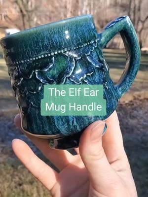 This is how I make my elf ear mug handles. Not only is it a lovely shape, but it feels good in the hand and adds a nice balance to the mug. #mughandle #mughandles #mug #potterymug #ceramicmug #pottery #ceramics #potterytiktok 