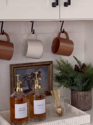 I’ve always wanted a coffee bar so figured why not create a mini one 😍☕️👏🏼! This may be my favorite corner in our kitchen now and loveeeee how this came together!  I wanted to avoid putting any holes in my cabinets or backsplash so I actually used a tension curtain rod under my cabinets since there was enough space for it. I’ll be sure to share more on this in my stories!  Comment BAR below to receive a DM with the link to shop this post on my LTK ⬇ https://liketk.it/53eTI #ltksalealert #ltkhome #ltkseasonal What’s your favorite part of my coffee bar?! 😍  . . #homevibesdecorjan21 #homedecor #decoronabudget #homeinspo #homesweethome #affordablefinds #homeinspiration #homedecoration #homedesign #beforeandafter #coffeebar #coffeelover #coffeetime #coffeeaddict #coffeetime #decoronadime #homesensefinds #amazonfinds #amazondeals #coffeebardecor #whitekitchen #kitchendesign #kitchendecor #neutralhome #targetfinds