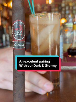 ✨ Experience a perfect pairing with a La Flor Dominicana La Volcada cigar and a Dark & Stormy cocktail. 🌪️ The cigar unveils full-bodied notes of pepper, leather, molasses, espresso, and licorice, beautifully complementing the rum and citrus blend of the cocktail. This harmonious match brings warmth and richness to your evening. Enjoy the exquisite flavors today! 🍹 #CigarPairing #FlavorNotes #DarkAndStormy #CigarAficionado #EveningIndulgence #CigarExperience #CocktailHour #RumLovers #CitrusCocktail #CraftCocktails #MixologyMagic #CocktailTime #PerfectPairing #TasteHarmony #DrinkAndSmoke 