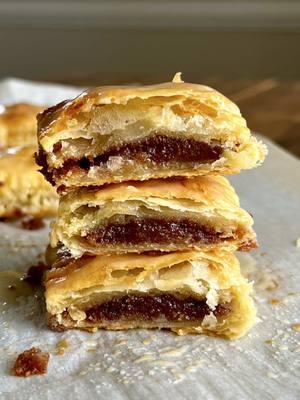 MINI BROWN SUGAR CINNAMON SOURDOUGH TOASTER STRUDELS Me singing this to my sourdough starter 🥹🫶 Recipe below OR go to my website through the link in my bio 🤎  #Recipe Details (6 minis): Sourdough Puff Pastry: - 205g all-purpose flour - 7g salt - 226g butter, cold & grated - 60g water - 113g sourdough discard Filling: - 1/4 cup + 2 tbsp brown sugar - 1/2 tbsp all-purpose flour @Bob’s Red Mill  - 1/2 tbsp cinnamon - 1 tbsp butter, melted - 1 tsp vanilla extract - 1 egg + 1 tbsp milk, for egg wash *Glaze recipe on my website + more specific details*  Instructions: Prepare the SD puff pastry. Whisk together the sourdough discard and water. In a large bowl, whisk together the flour and salt. Add butter, and mix. Add the discard mixture and stir. Then knead with your hands until well combined and there are no dry bits of flour. Wrap in plastic wrap & roughly shape into a rectangle. Place in the fridge for 30mins to chill. Place the dough onto a floured surface & roll out into a large rectangle (~18”x8”). Perform a book fold. Specific instructions on how to do these are on my website! Wrap in plastic wrap & chill in the fridge for 30 mins.  Then remove, and roll it into a long large rectangle (~24x8”). Perform 2-3 series of letter folds (details on my website).  After the last fold, roll the dough into a large rectangle (12”x8”), fold into thirds, and tuck a piece of parchment paper in between the folds. Refrigerate the dough for at least 1 hr before using. Make the toaster strudels. Preheat the oven to 400F & line a baking sheet with parchment paper. Set aside.  Make the filling by mixing together all of the ingredients in a medium bowl. Divide the puff pastry in half. Save whichever half you aren’t using to use another time, if desired. Slightly roll out the puff pastry on a sheet of parchment paper. Cut into 12 small rectangles. Spoon ~1/2 tbsp of the filling in the middle of half (6) of the rectangles, leaving ~1/2” border. Brush the edges with the egg wash. Place the other 6 rectangles over the ones with the filling. Use a fork to seal. Transfer the strudels to the baking sheet. Brush the tops with the egg wash. Bake at 400F 15-18 mins, or until golden brown.  Drizzle the glaze over the toaster strudels. Enjoy! #sourdough #sourdougbread #sourdoughdiscard #sourdoughdiscardrecipe #sourdoughstarter #homemade #homemadesourdough #sourdoughrecipe #toasterstrudels #homemadetoasterstrudels #brownsugar #cinnamon #pastry #puffpastry #baking #Breakfast #brunch #snack #dessert