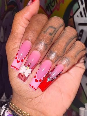 Not in love with anyone then be in love with your nails 🌹💅🏾💖 Book this look for in time for Valentine’s Day!! Link in bio ✨ All products from @Nails Blinged Supply LLC 💘💟 USE CODE UNIGANG 🦄😜 ♡ Lotus Acrylic Powder ♡ NB95 Pink Gel Polish from VDAY BUNDLE ♡ NB82 Red Gel Polish from VDAY BUNDLE ♡ NB309 Red Disco Gel Polish ♡ NB Diamond Gloss Top Coat ♡ NB Valentines Assorted Bows Pack ♡ All Stones/ Crystals and  ♡ NB 5D Stone Gel   #acrylixx #nailart #calinails #909nails #nails #nailtech #blackgirlsdonails #nailsblingedsupply #rialtonails #instareels #longnails #valentinesdaynails #rednails #vdaynails #valentinesnails #nailsofinstagram #nailsinspo #pinknails #instanails #valentines #lovenails #acrylicnails #naildesign #nailporn #heartnails #nailsblinged #frenchnails #glitternails #blackwomeninnails #viralreels