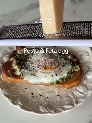 pesto & feta egg toast recipe below🤍 all I really have to say is you have to try this it’s so good and I can’t stop making it 🫶🏼 Ingredients: -Pesto (use your favorite or I homemade mine!!!)  my pesto recipe: -1/4 cup pine nuts  -1 cup fresh basil  -1 clove grated garlic  -1/8 cup Parmesan cheese  -1/2 lemon squeezed  -salt & pepper to taste -1/8 cup or more olive oil  -1 egg  -1 piece your fav bread toasted  -1/8 cup feta  -salt & pepper  -chili flakes  -hot honey  -parmesan Instructions: -toast your bread. heat a pan on medium heat. Add your feta in a small circle and allow it to melt a bit. Next add your pesto to the circle. Crack your egg in the middle and let it cook, covering for a few minutes so it cooks through. Add to your toast and top with salt, pepper, chili flakes, hot honey and more parmesan cheese. Enjoy!!!  #toast #pesto #pestoeggs #breakfastidea #fetaeggs #breakfast #EasyRecipes #healthyrecipes #pestorecipe #healthylifestyle 