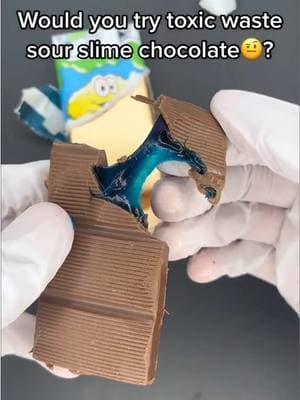 I don’t know how I feel about slime filled chocolate😅 #slime #chocolate #chocolatebar #toxicwaste #slimecandy #tastetest #slimelicker #blue #chocolates 