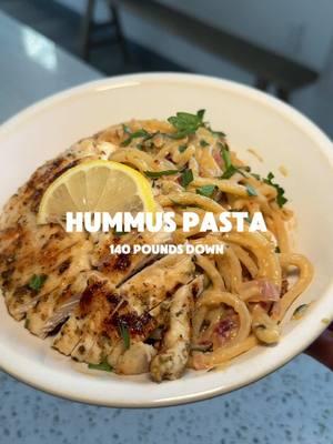 Hummus Pasta !! Full recipe 👇 (With chicken) Makes 4 servings! Ingredients:  * 10 oz dry pasta of choice  * 1tbsp olive oil * 1 medium diced red onion * 3 cloves minced garlic * 1/2 cup sun dried tomatoes (not in oil) * 1 cup hummus * 3 tbsp lemon juice * 1/2 cup pasta water * 1 tsp chili flakes  * 15 oz chicken  * Handful of fresh parsley Method: 1. Season your chicken with salt and pepper (and any other seasonings you prefer! I think oregano works well with this recipe!) 2. Heat up a skillet with olive oil and cook your chicken on each side until cooked through. Remove from pan and let rest. 3. While your chicken is cooking, bring salted water to a boil and add in your pasta of choice. (don't drain your pasta without reserving 1/2 of a cup!) Also use this time to mince your garlic and chop your onion. And soak the sun-dried tomatoes in hot water to soften. (If you are using jarred sun dried tomatoes you don’t have to do this step and also keep in mind the nutrition will be off a bit but that’s okay!) 4. In the same pan you cooked your chicken in, add a small drizzle of oil, the red onion, and chili flakes stir that around and let the chili flakes toast up a bit. Add in your lemon juice, sun dried tomatoes and minced garlic and mix. 5. Reduce the heat to low, stir in the hummus, and 1/4 a cup of reserved pasta water. (keep the rest of the pasta water incase you need/want to thin out the sauce!) 6. Finally, stir the pasta into the sauce until the hummus is well combined and, optionally, add more pasta water until you reach your desired consistency. Garnish with fresh parsley 7. Serve with cooked chicken on top or on the side! Estimated nutrition per serving:  Calories: 475 P: 32 F:17 C: 45 If you wanted to make this vegetarian and still have a lot of protein in it you could use a protein pasta or top with nutritional yeast! App access is in my bio!! Register for my 365 Club today!! Which is my year long fitness challenge with the grand prize of $5,000 to 3 lucky winners! Recipes just like this will be found in my club! Be sure to click my link for customized meal plans, workout guides with video demos and full access to me and my amazing team of women! Let’s reach your goals together 💖 💪🏻 Remember I lost 140 pounds WITHOUT restricting!!!! #mealinspo #dinnerinspo #healthyfood #healthyrecipes #weightlossrecipes #caloriedeficit #highprotein #easydinner #mealplan #hummus #pasta #healthypasta 