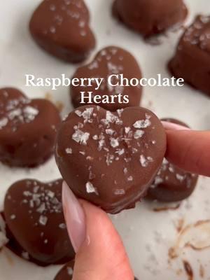 Save this dessert for your Valentine💘  Ingredients❤️ - 1 cup fresh raspberries - 1 tbsp agave syrup - 2 tbsps chia seeds - 1 cup chocolate chips - 1 tbsp coconut oil - Topping: Flaky salt (optional) Utensils❤️ - heart shaped ice cube mold (linked in my Amazon storefront) How to make them❤️ 1. In a bowl, mash raspberries, and mix in syrup and chia seeds. 2. Scoop raspberry mixture into heart shaped molds. Freeze overnight. 3. Melt chocolate chips and coconut oil in the microwave. 4. Dip each raspberry heart into the melted chocolate and place it on a parchment lined plate. 5. Sprinkle flaky salt on top while the chocolate is still melted.  6. Store in the fridge in an airtight container. Enjoy!🥰 ##ValentinesDay##bemyvalentine##heartshapedfood##valentinesdessert##valentinesfood##easydessert##valentinesurprise##valentinegifts##healthydessert##nobakedessert##valentines##chocolateraspberry##recipes##heartshaped##valentines##lovedessert