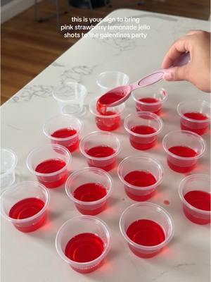 These were a big hit and got eveyone feeling nice 😎 the recipe is simple  1 cup of juice (I used strawberry lemonade)  1 cup of vodka (or whatever liquor your want to use) 1 jello packet (I used strawberry flavor)  Instructions: Boil the juice, once simmering art to one packet of jello, mix until well combined then add cold drink aka your alcohol then mix again and pour into your shot cups. I did serving of 2 tbs per shot which is exactly 1 shot worth of liquid 🙌🏽 The feedback I got is that they were strong but tasted good.  #jelloshots #velentinesday #galentinesday #galentinesparty #galentinesdayideas #pinkdrink #drinkrecipes #shots 