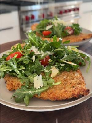 Chicken milanese✨ Chicken:▪️2 Chicken Breasts▪️Kosher Salt & Pepper▪️1/4 Cup Flour▪️1 Large Egg▪️1/4 Cup Panko Breadcrumbs▪️1/4 Cup Italian Breadcrumbs▪️1/4 Cup Grated Parmesan▪️Avocado Oil Spray or Olive Oil Spray▪️ Arugula Salad:▪️4 Cups Arugula▪️10 Cherry Tomatoes, sliced in half▪️1/4 Cup Shaved Parmesan, plus more for serving▪️Freshly Squeezed Lemon Juice▪️Olive Oil▪️Salt & Pepper▪️ 1️⃣ Preheat the oven to 425F convection (or 450F regular bake) and line a baking sheet with a wire rack. Spray the wire rack with oil. (If you don't have a wire rack, just oil the baking sheet.) 2️⃣ Working one at a time, place the chicken breast in between two pieces of plastic wrap and pound with the flat side of a meat mallet (or something heavy) until 1/4-inch thick. Season with salt and pepper on both sides.  3️⃣ Set up your dredging station: Add the flour to a large shallow bowl, beat the egg in another large shallow bowl, and combine the panko, Italian breadcrumbs, and parmesan in a third large shallow bowl. 4️⃣ Coat both sides of each chicken breast in flour, then egg (letting excess drip off), then the breadcrumb mixture, pressing the breadcrumbs on with your fingers. Place the chicken on the greased wire rack on the baking sheet.  5️⃣ Spray the top of the chicken cutlets generously with oil and bake for 12-15 mins until the internal temp reaches 165F. Option to broil at the end for 1-2 mins to get the top of the cutlets extra golden brown.  6️⃣ While the chicken bakes, add the arugula, cherry tomatoes, and parmesan to a bowl. Dress to taste with lemon juice, olive oil, salt, and pepper.  7️⃣ Serve the chicken with a generous mound of arugula salad on top. Sprinkle on some extra shaved parmesan and enjoy! ⏲30 minute total prep + cook time Recipe serves 2 people For all recipes delivered to your inbox weekly (with printable PDFs) + access to the searchable recipe archive, subscribe to my newsletter via the link in my bio 😘 . #maxiskitchen #chickenmilanese #recipesoftikok #EasyRecipes #healthyrecipes #recipeideas 