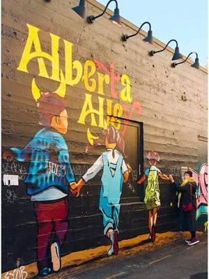 Have you checked out Alberta Alley in the Alberta Arts District? @Smile4Travel is taking you to this tiny corner packed with delicious food, vibrant art, and local entertainment! 🎨🍗🍹 FOOD STOPS 🍴 🍗 𝗕𝗔𝗘𝗦 𝗙𝗿𝗶𝗲𝗱 𝗖𝗵𝗶𝗰𝗸𝗲𝗻: Southern-inspired classics like chicken & waffles in a bright, tropical diner setting. 🍜 𝗙𝗮𝘁 𝗞𝗶𝘁𝘁𝘆 𝗥𝗮𝗺𝗲𝗻 @fatkittyramen: Japanese sake, edamame, and soul-warming bowls of ramen. 🍹 𝗞𝗮𝘆𝗮 @itskicksandcocktails: Sophisticated cocktails with creative twists. 🍩 𝗞𝗶𝗻𝗻𝗮𝗺𝗼𝗻𝘀 @kinnamonsbakery: Freshly baked cinnamon rolls—need we say more? ARTS & ENTERTAINMENT 🎨 🎭 𝗔𝗹𝗯𝗲𝗿𝘁𝗮 𝗥𝗼𝘀𝗲 𝗧𝗵𝗲𝗮𝘁𝗿𝗲: A neighborhood institution offering live music, comedy, film and more. 🍶 𝗦𝗶𝗱𝗲 𝗗𝗼𝗼𝗿 𝗖𝗲𝗿𝗮𝗺𝗶𝗰 𝗚𝗮𝗹𝗹𝗲𝗿𝘆: Featuring daily use, functional, hand-made pottery by Manya Wubbold.  🖼 𝗚𝘂𝗮𝗿𝗱𝗶𝗻𝗼 𝗚𝗮𝗹𝗹𝗲𝗿𝘆: Showcasing Portland-based artists. Owner Donna has run this gallery for 27 years and co-founded Last Thursdays in Alberta. 💍 𝗖𝗹𝗮𝘂𝗱𝗶𝗼 𝗦𝘁𝗮𝗿𝘇𝗮𝗸 𝗝𝗲𝘄𝗲𝗹𝗿𝘆: Specialized in wedding bands and custom pieces with emphasis of recycled precious metals and ethically mined Diamonds. All three shops are located in Guardino Arts building and connected to each other.  𝙒𝙝𝙖𝙩 𝙚𝙡𝙨𝙚 𝙙𝙤 𝙮𝙤𝙪 𝙣𝙚𝙚𝙙 𝙩𝙤 𝙨𝙬𝙞𝙣𝙜 𝙗𝙮 𝘼𝙡𝙗𝙚𝙧𝙩𝙖 𝘼𝙡𝙡𝙚𝙮? ✨ #TravelPortland #ThisIsPortland #AlbertaArtsDistrict #AlbertaAlley #PortlandEats #PortlandArt #ExplorePortland #AlbertaArt #portlandartist #localartists #artsdistrict #portlandartscene #portlandart #localart #youcaninportland #pdxnow #CoolCornersOfPDX #portlandoregon #portlandstyle #portlandmade #supportsmallbusinesses #NEportland #pdxeater #pdxdrinks #portlandlife #pdxfood #eaterpdx #pdxeats #Smile4TravelinPortland 