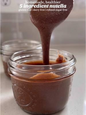 5 ingredient homemade nutella! it’s gluten free, dairy free, and refined sugar free, and so delicious. ingredients •2 cups (about 260 grams) raw hazelnuts — or use roasted and shelled hazelnuts (skip steps 1 and 2 if you do) •3 TBS granulated sweetener (coconut sugar and maple sugar work well( •3 TBS cocoa or cacao powder •1 tsp pure vanilla extract •1/2 tsp salt instructions 1. add the raw hazelnuts to a tray and bake at 350°F for 12-15 minutes, until the skin is falling off the hazelnuts. remove from the oven and allow them to cool. 2. once cooled, rub the hazelnuts between your fingers to remove the skin. continue until all the skin has been removed. 3. place the roasted and shelled hazelnuts in a food processor and process until smooth (it will take about 5-10 minutes). 4. once smooth, add in the cocoa powder, granulated sweetener, salt, and vanilla, and process again until well combined (you may need to scrape down the sides of food processor throughout the process). 5. taste the nutella and add more cocoa powder or sweetener, if desired. once finished, pour the nutella into a jar and enjoy! 6. store in the pantry for up to 2 weeks, in the fridge for up to 1 month, or in the freezer for up to 3 months. notes •feel free to add some melted dark chocolate to the nutella for a sweeter, firmer spread (will firm up once cooled). #nutella #homemadenutella #vegannutella #nutellarecipes #glutenfreerecipes #dairyfreerecipes #refinedsugarfree 