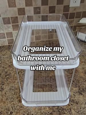 Organize my bathroom closet with me using this 2 Tier Multi-purpose shelf. #cleaninghack #shelves #organize #cleanwithme #cleaningsupplies #messy #bathroomshelf #storage 