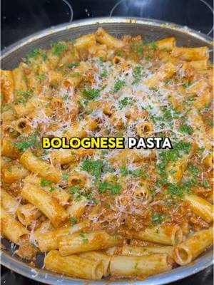 Authentic Pasta Bolognese 🍝 recipe ⬇️ Serves 4-6 4 oz diced pancetta 1 large celery rib 1 medium carrot 1 medium onion 1 lb ground beef 80/20 1/2 lb ground pork 2 tsp salt 1 tsp pepper 28 oz tomato puree 3/4 cup dry white wine 1/2 cup beef stock 1/2 cup milk 1/4 cup heavy cream 2 bay leaves 2 Parmesan rinds 16 oz pasta of choice Salt & pepper to taste Render down pancetta in a large pot on medium heat until crispy. Remove and set aside. In the same pot, cook down onion, carrot and celery with some butter and olive oil until translucent and softened. Toss in ground beef and ground pork with a generous amount of salt and pepper. Break it up and cook until browned. Pour in wine and let most of it evaporate before adding strained tomatoes or tomato puree & beef stock. Add bay leaves & Parmesan rinds, and cook on low semi-covered with a lid for at least 2 hours or until it reaches your desired thickness. Add milk & cream at the end while you cook your pasta in heavily salted water. Combine with al dente pasta, Parmesan cheese and parsley. #bolognese #valentinesdaydinner #pasta #pastalover #datenight 