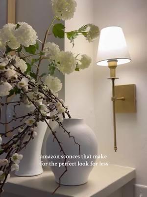 I purchased these sconces two years ago and they truly are the perfect look for less! They come in a set of two to make an effortless statement in any space. Shop in my B I O!  #classichomedecor #moderntraditional #affordablehomedecor #homedecor #classicstyle #wallsconces #wallsconce #homestyle #amazonhome #affordablelighting #amazonfinds #amazonmusthaves #amazonfavorites 