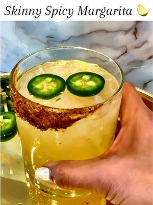 Spicy Skinny Margarita 🍋‍🟩🍊🍹 Ingredients * 1/4 jalapeño, chopped (leave seeds out for less heat) * 2 ounces blanco tequila * 5 - 7 dashes orange bitters  * 1/2 lime, juiced * 1/2 small orange, juiced * 1/2 ounce sugar free syrup * Garnish: low sodium tahin, sugar-free chamoy, jalapeno coins Steps * Rub the rim of a rocks glass with a lime wedge or coat with sugar-free chamoy, dip the rim in tajin to coat, and set aside. * Add the chopped jalapeño to a shaker and gently muddle. * Add the blanco tequila, orange bitters, lime and orange juice, and simple syrup to the shaker.  * Add ice, and shake until well-chilled. * Strain into the prepared glass over fresh ice. * Garnish with a couple jalapeño coins #margaritarecipe #skinnymargaritarecipe #skinnycocktails #bartok #margarita #spicymargarita 