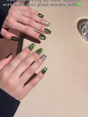 ✨ Unleash your inner witch with these enchanting green cat-eye press-on nails, inspired by the magic of Wicked. 💚🖤 Handcrafted, reusable, and designed to catch the light like Elphaba’s power, these nails are perfect for those who love a little boldness with their elegance. Subtle shimmer on the ring finger adds just the right amount of magic to your look. ✨ 🌿 Channel the mystique of Wicked—how do you wear your spellbinding style? Share with us below! 👇 #luloulife #luloupressonnails #wickedmovie #wickedinspired #wickedvibes #greenmagic #cateyenails #nailwitchery #handcraftednails #reusablenails #nailinspo #wickedstyle #wickedthemusical #nailglowup #tiktokshopjumpstartsale #TikTokShopJumpstartSale 